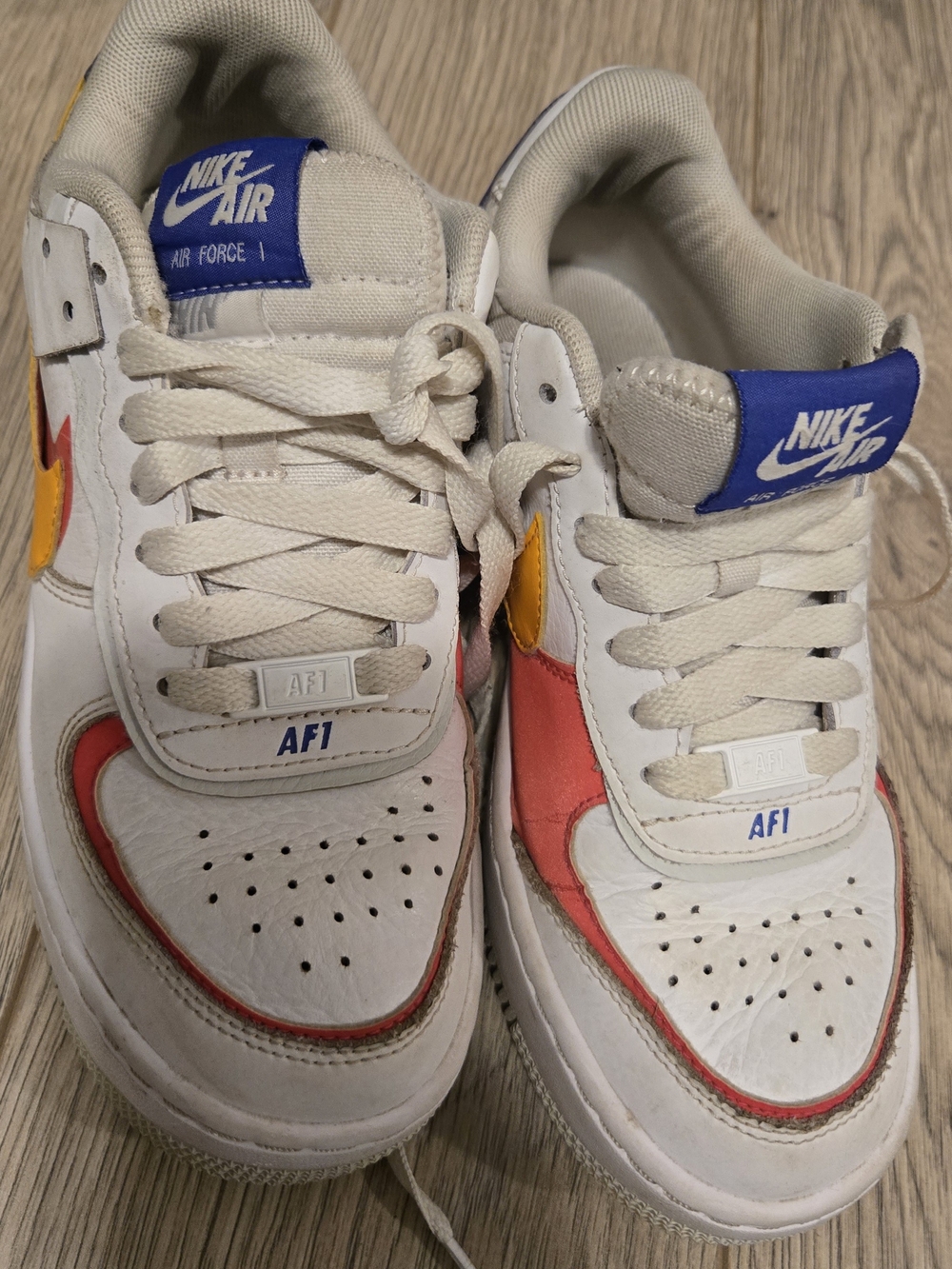 Nike Kids Sneakers in White with Red & Yellow Accents